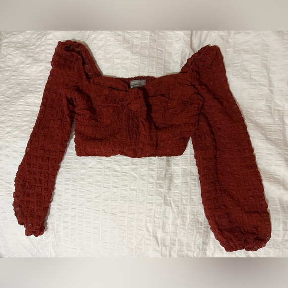 Urban Outfitters Tops - URBAN OUTFITTERS 
red long sleeve crop top with bowtie front